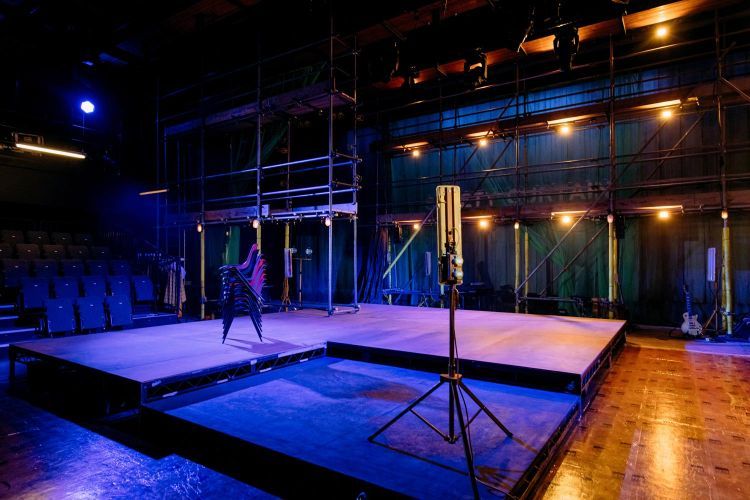 Empty set of Provok'd under blue and orange lighting